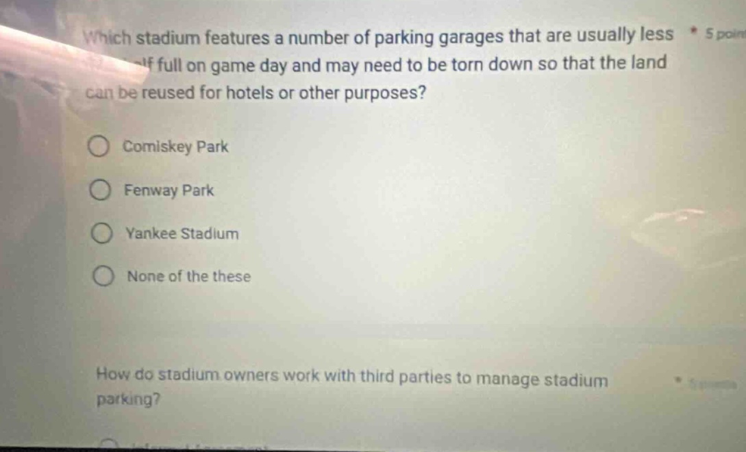 which stadium features a number of parking garages that are usually less half full on game day and may need to be torn down so that the land can be reused for hotels or other purposes? comiskey park fenway park yankee stadium none of these how do stadium owners work with third parties to manage stadium parking?