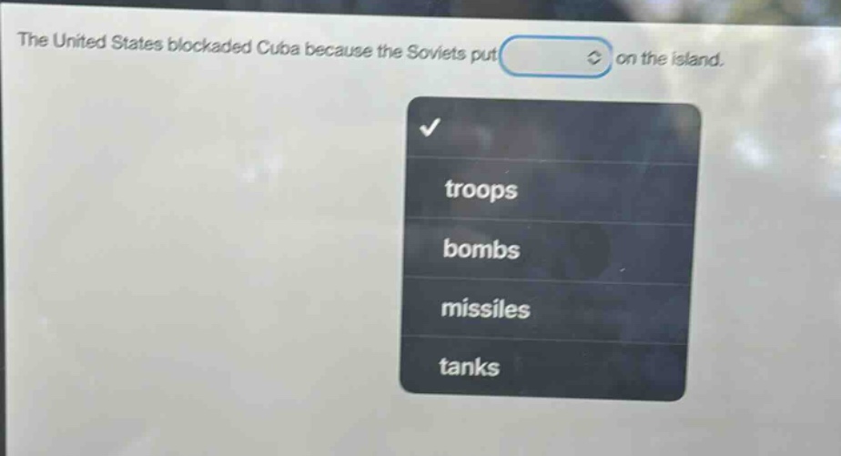 the united states blockaded cuba because the soviets put on the island. troops bombs missiles tanks