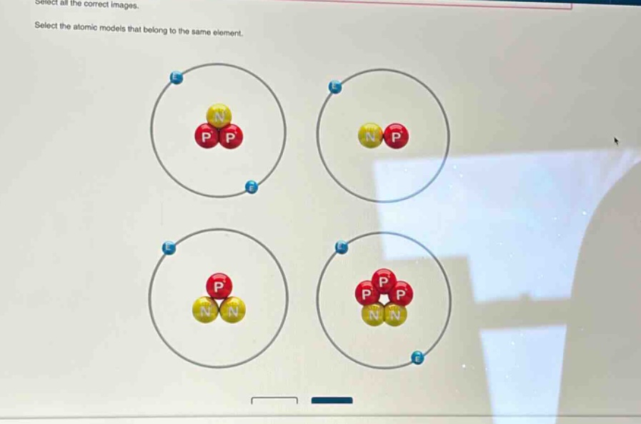 select all the correct images. select the atomic models that belong to the same element.