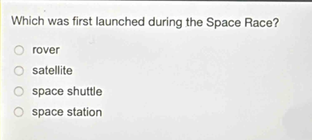 which was first launched during the space race? rover satellite space shuttle space station