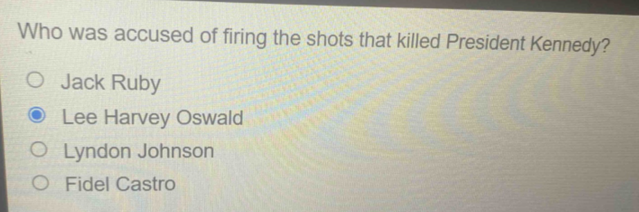 who was accused of firing the shots that killed president kennedy?\no jack ruby\no lee harvey oswald\no lyndon johnson\no fidel castro