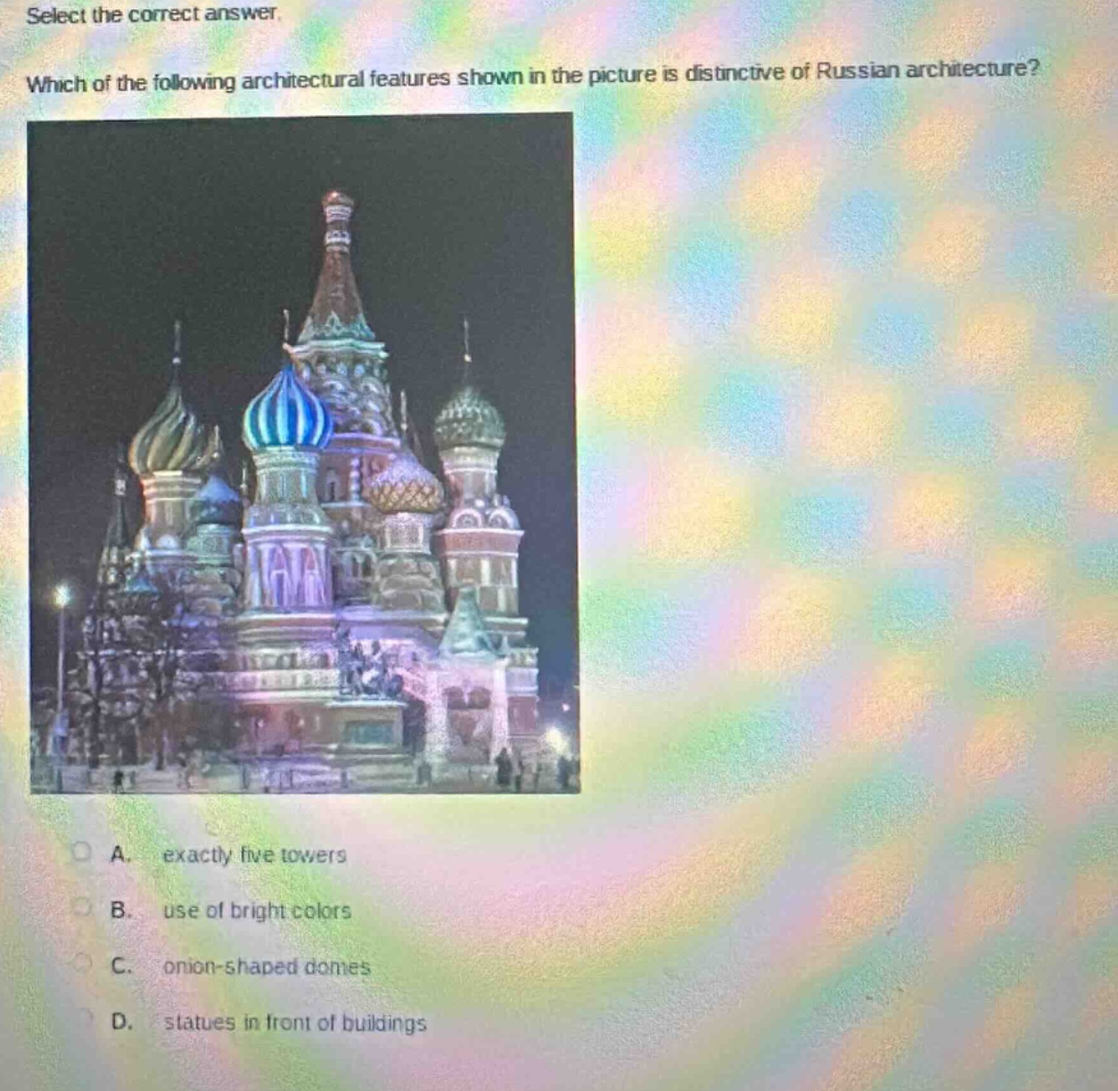 select the correct answer. which of the following architectural features shown in the picture is distinctive of russian architecture? a. exactly five towers b. use of bright colors c. onion - shaped domes d. statues in front of buildings