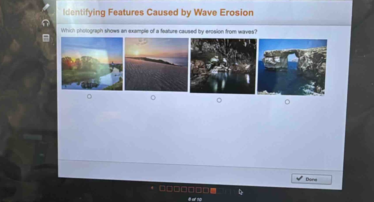 identifying features caused by wave erosion\nwhich photograph shows an example of a feature caused by erosion from waves?