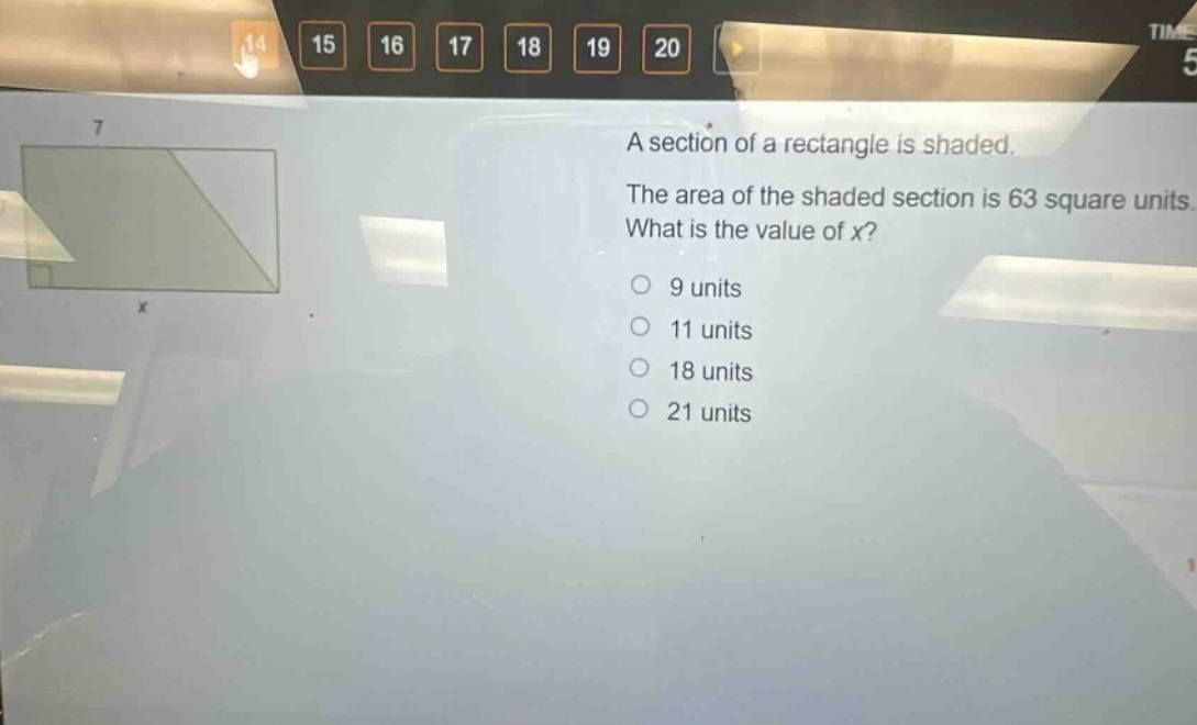 a section of a rectangle is shaded. the area of the shaded section is 63 square units. what is the value of x? 9 units 11 units 18 units 21 units