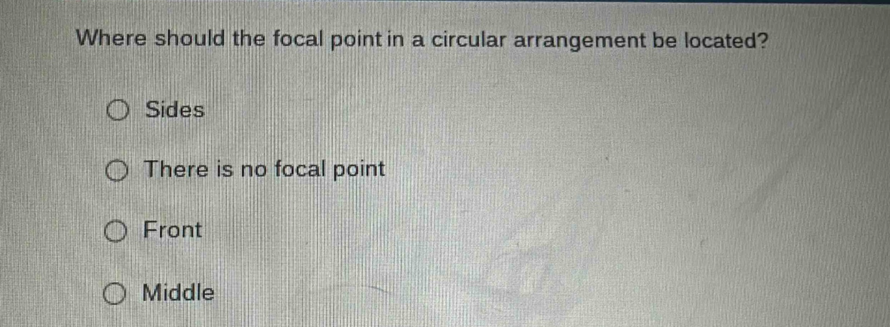 where should the focal point in a circular arrangement be located?\nsides\nthere is no focal point\nfront\nmiddle