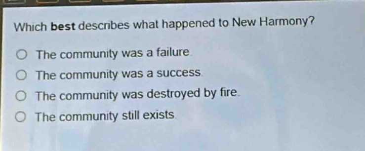which best describes what happened to new harmony?\nthe community was a failure.\nthe community was a success.\nthe community was destroyed by fire.\nthe community still exists.