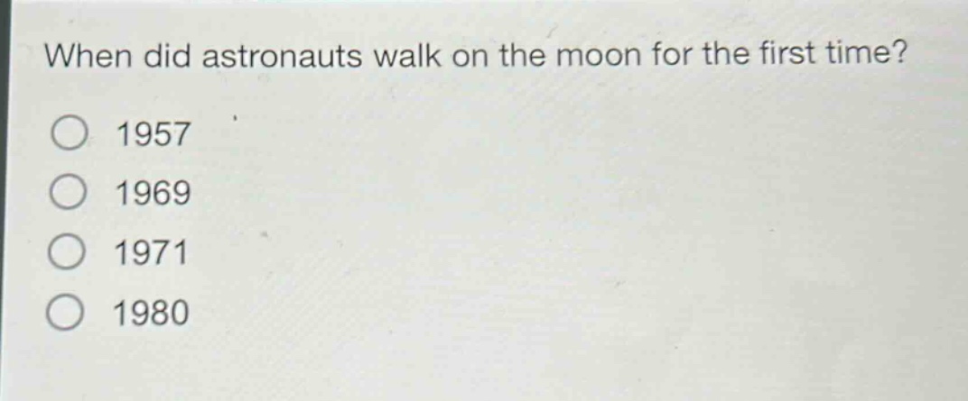 when did astronauts walk on the moon for the first time?\n1957\n1969\n1971\n1980