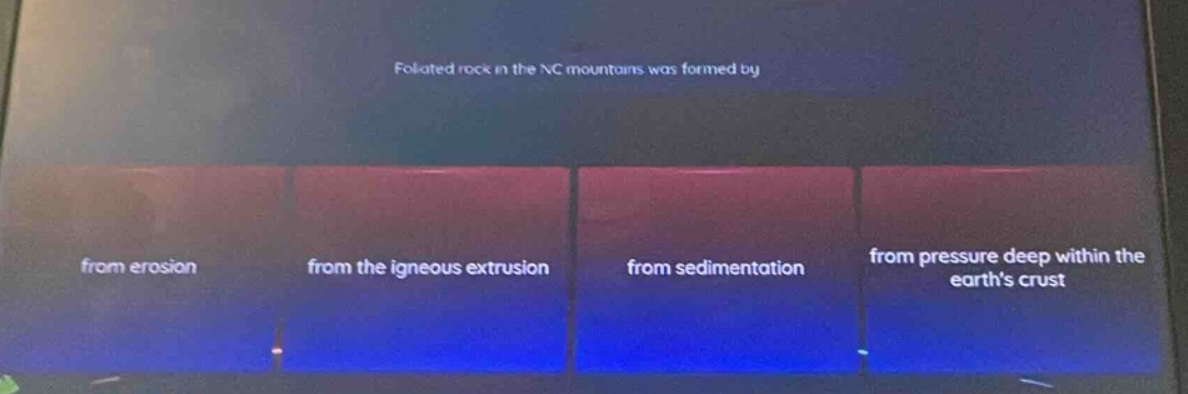 foliated rock in the nc mountains was formed by\nfrom erosion\nfrom the igneous extrusion\nfrom sedimentation\nfrom pressure deep within the earth’s crust