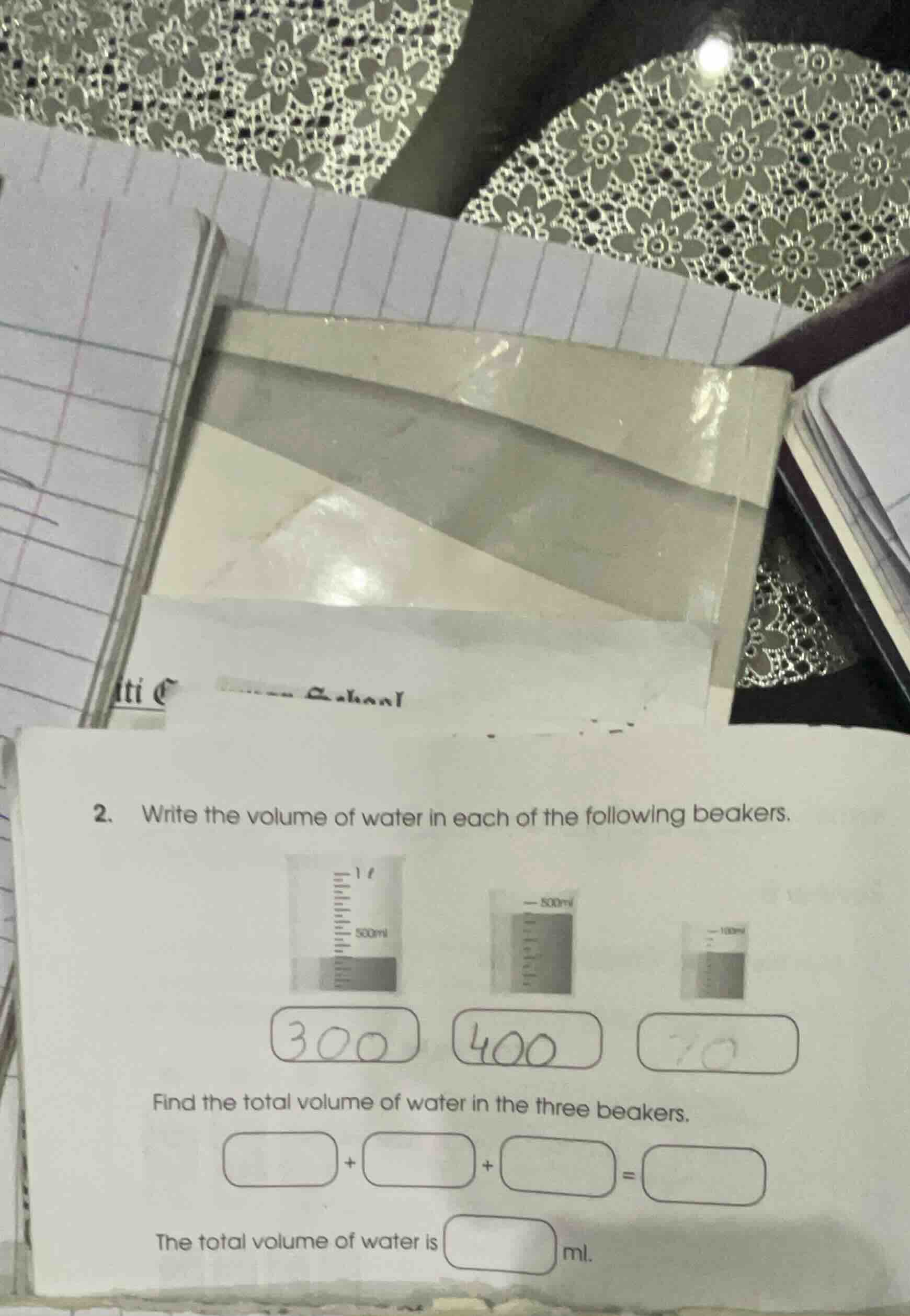 2. write the volume of water in each of the following beakers. find the…
