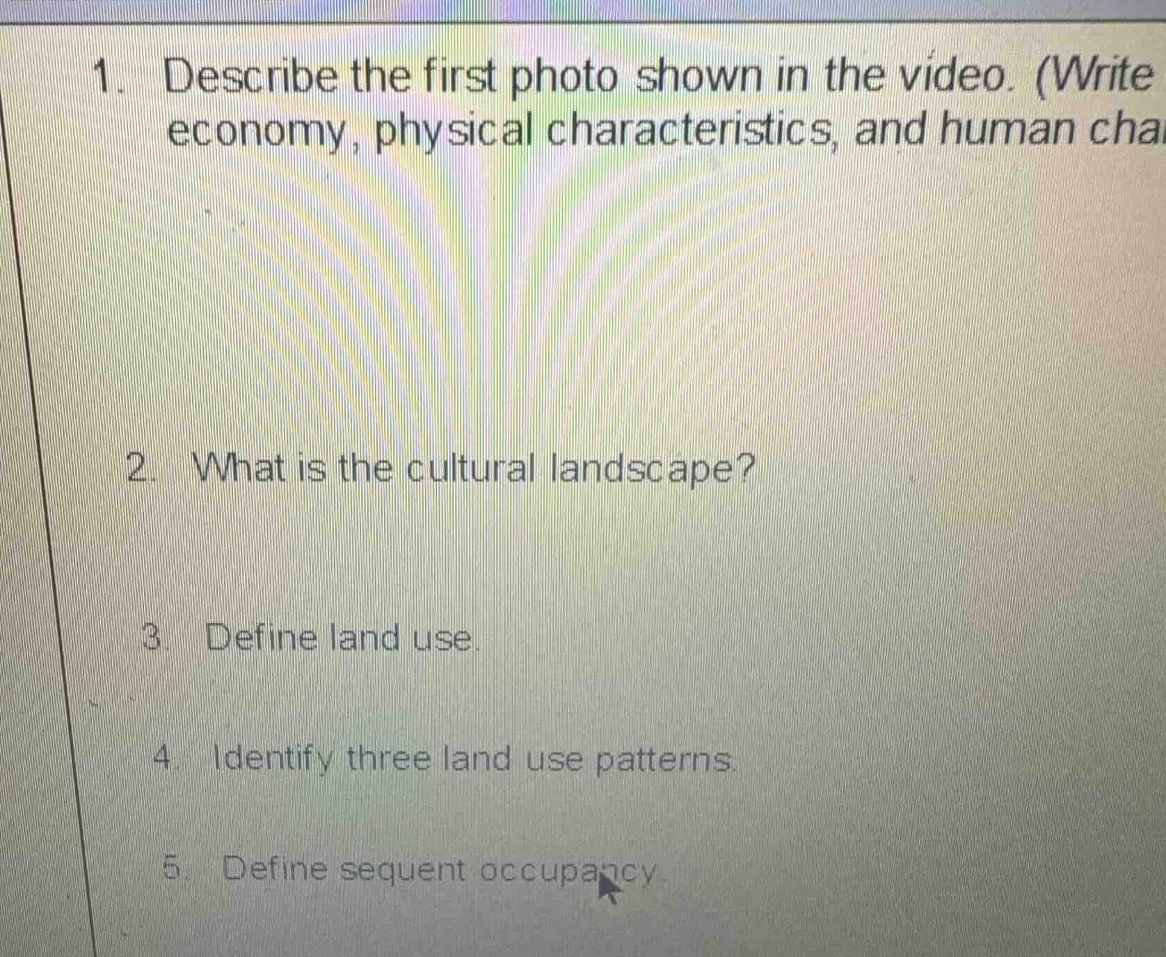 1. describe the first photo shown in the video. (write economy, physica…