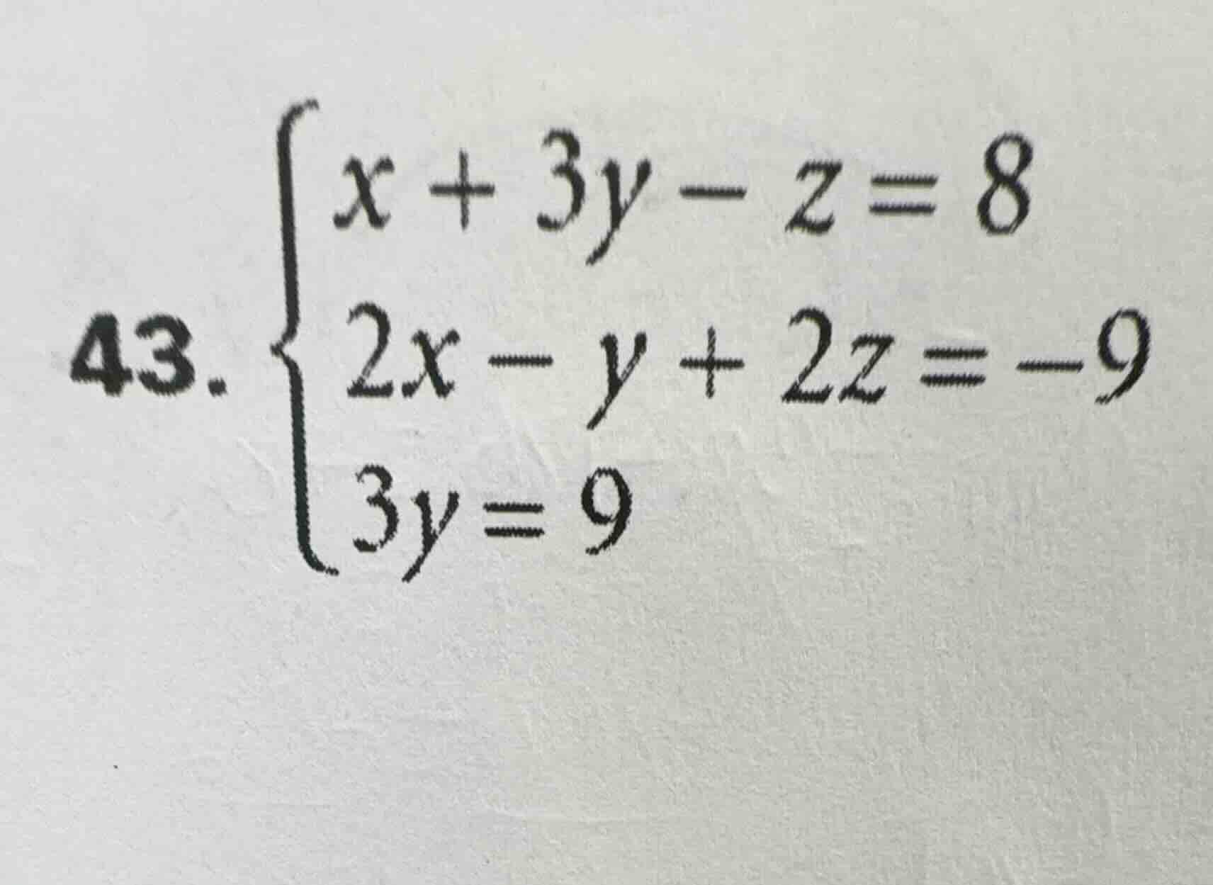 43. \\begin{cases} x + 3y - z = 8 \\\\ 2x - y + 2z = -9 \\\\ 3y = 9 \\e…