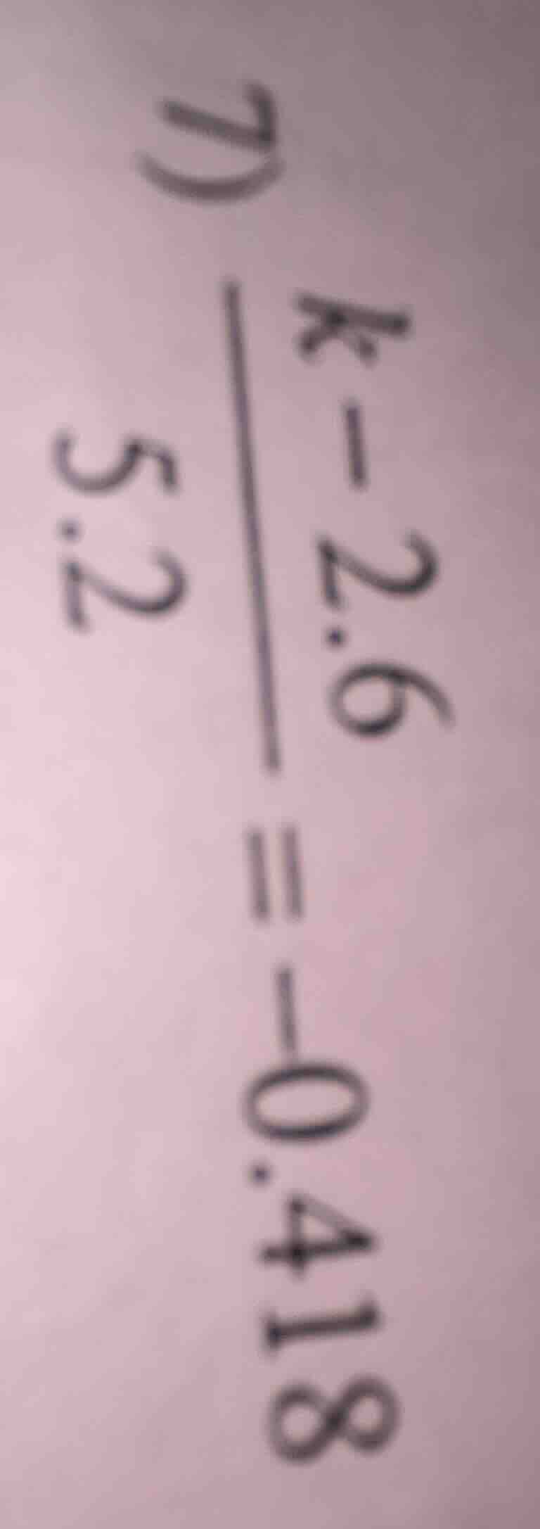d) \\(\\frac{k - 2.6}{5.2} = -0.418\\)