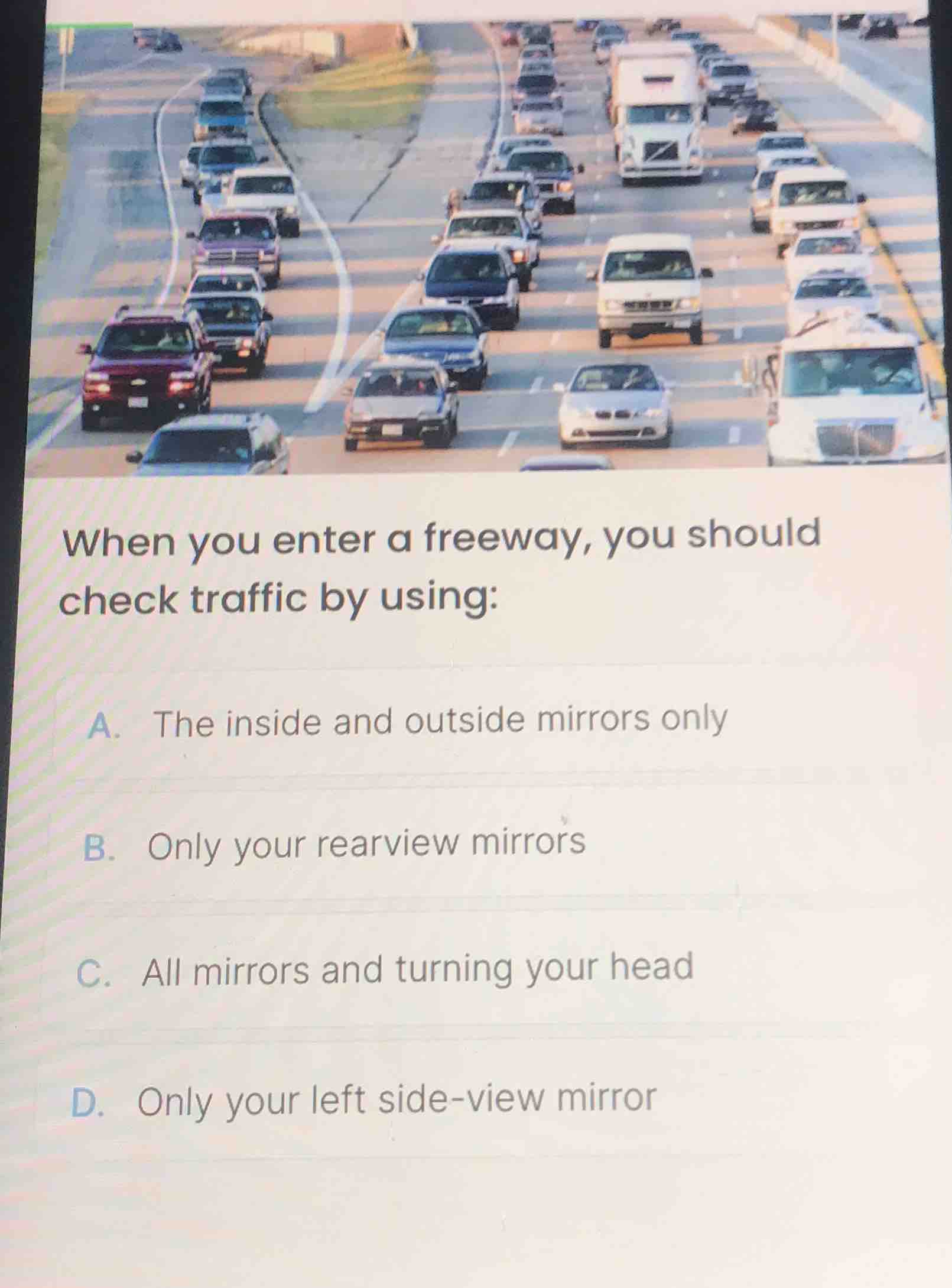when you enter a freeway, you should check traffic by using: a. the ins…