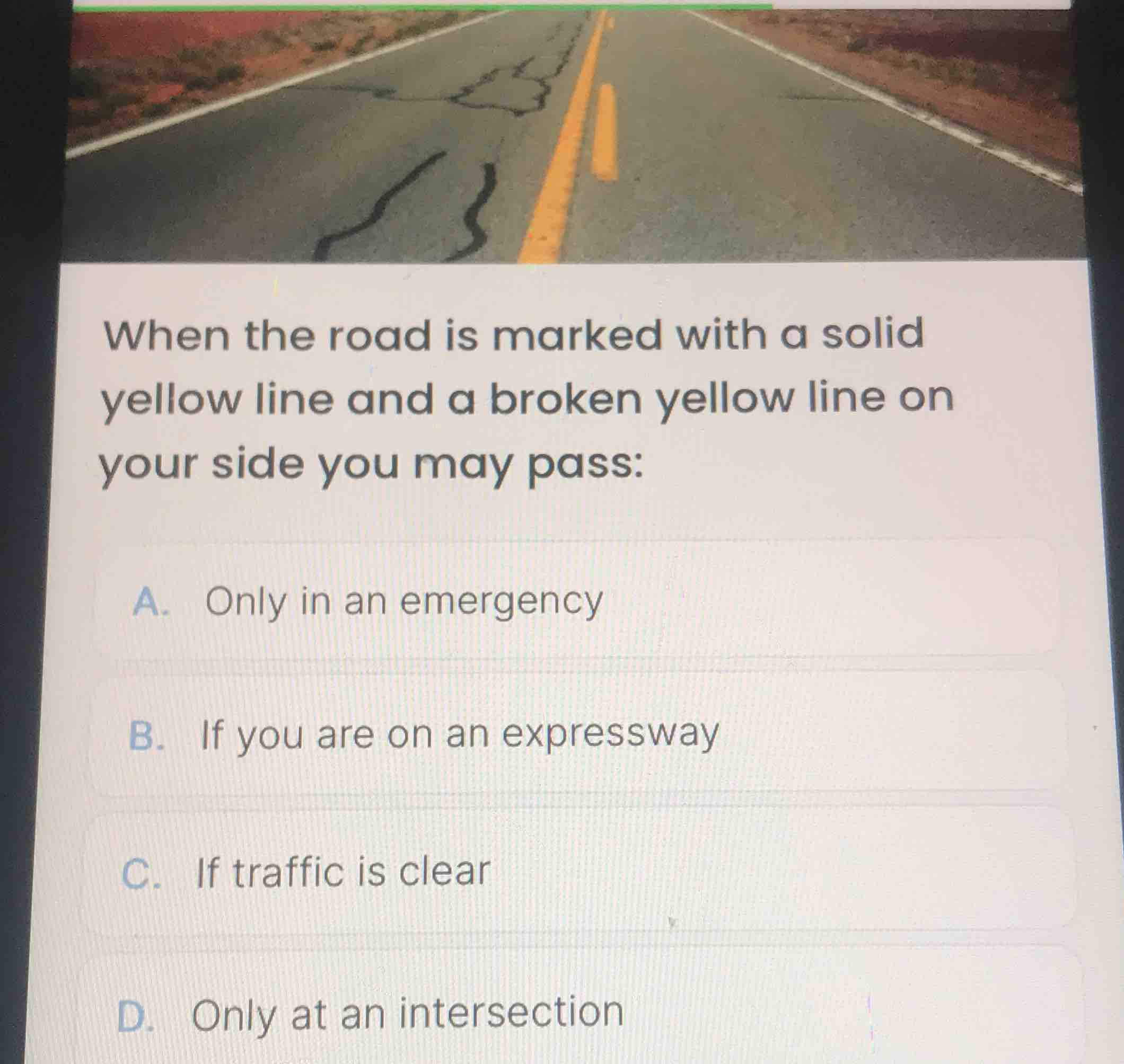 when the road is marked with a solid yellow line and a broken yellow li…