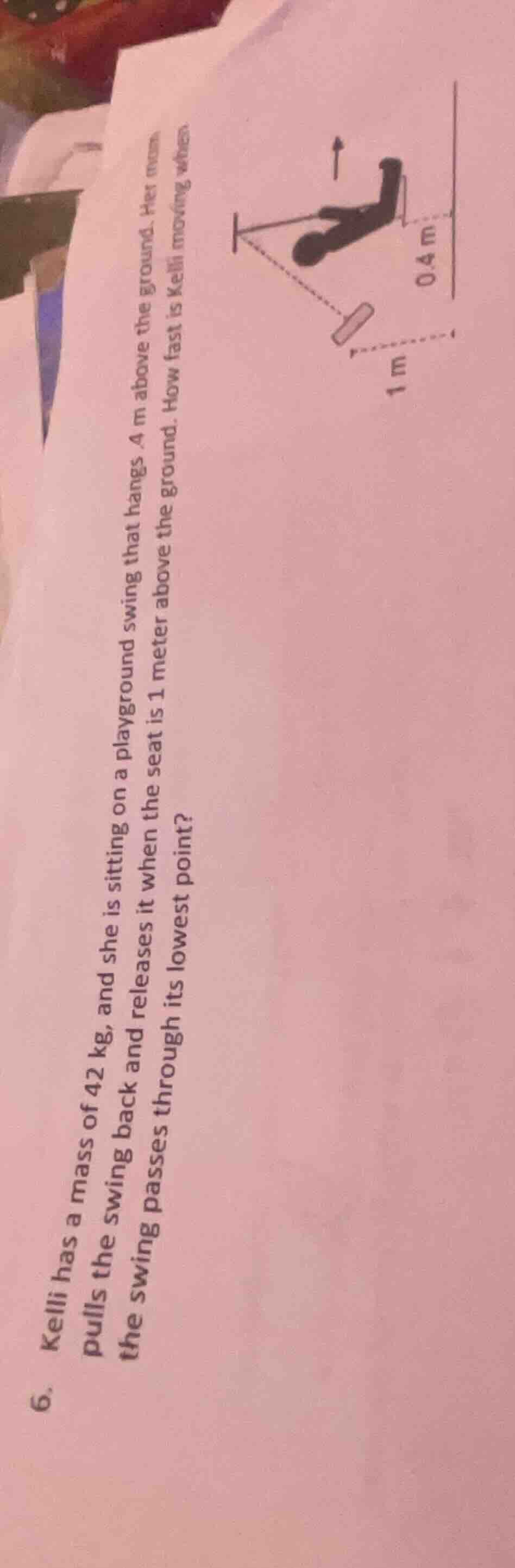 kelli has a mass of 42 kg, and she is sitting on a playground swing tha…