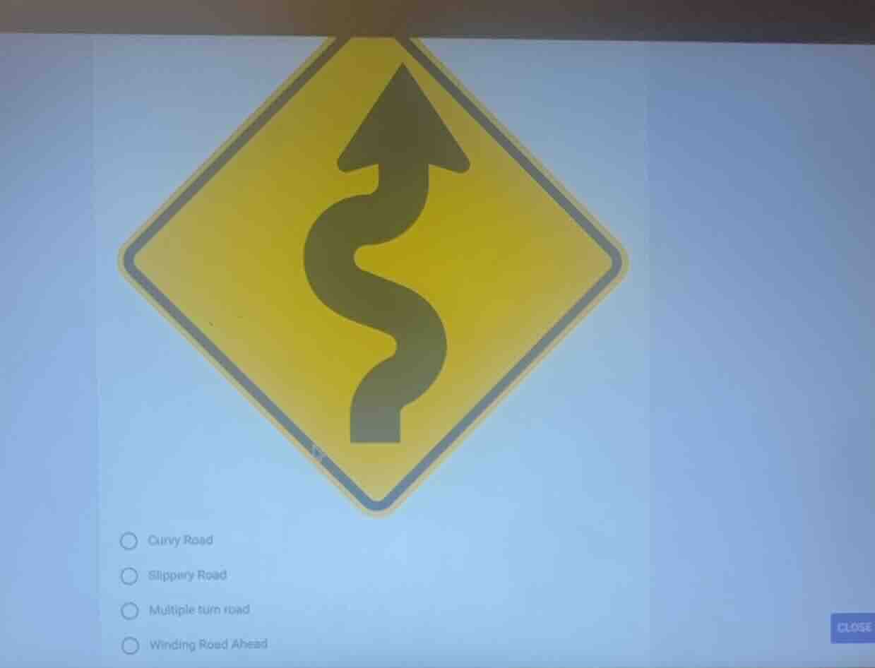 curvy road slippery road multiple turn road winding road ahead