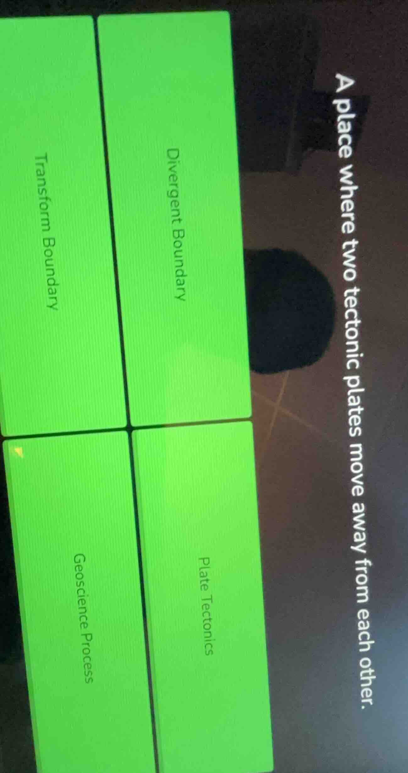 a place where two tectonic plates move away from each other. divergent …