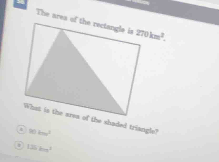 the area of the rectangle is 270 km². what is the area of the shaded tr…