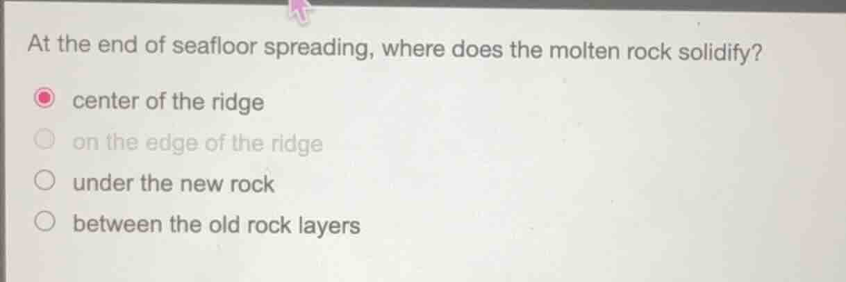 at the end of seafloor spreading, where does the molten rock solidify? …