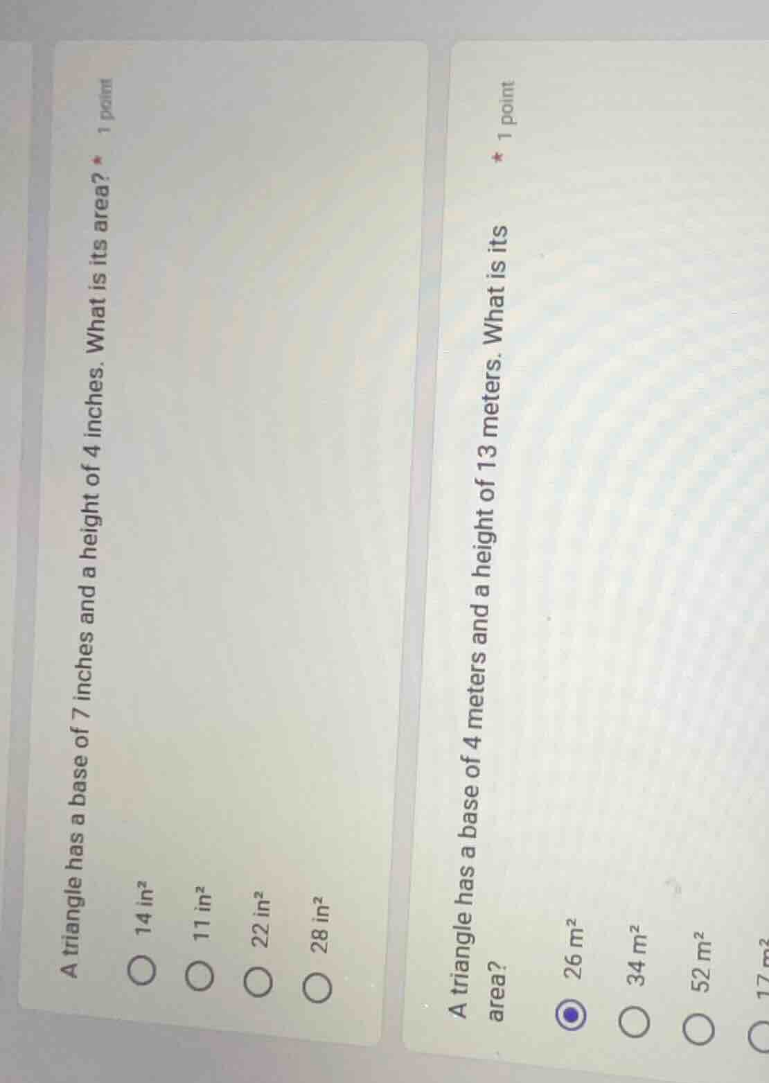 a triangle has a base of 7 inches and a height of 4 inches. what is its…
