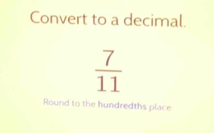 convert to a decimal. \\frac{7}{11} round to the hundredths place