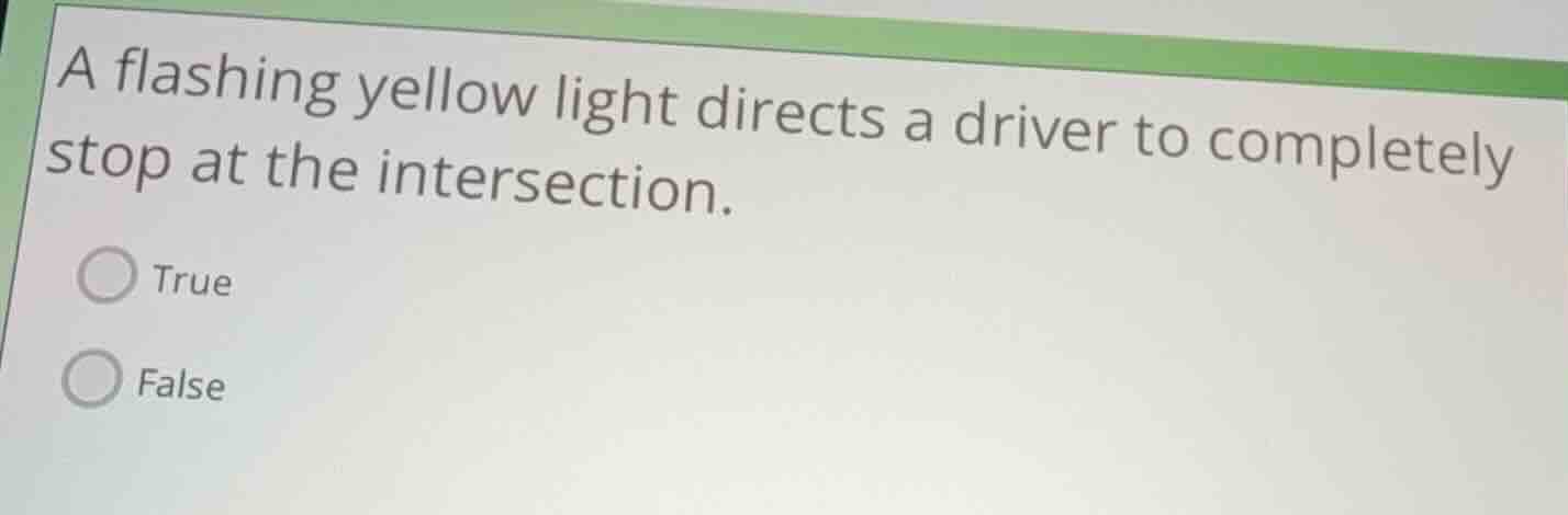 a flashing yellow light directs a driver to completely stop at the inte…