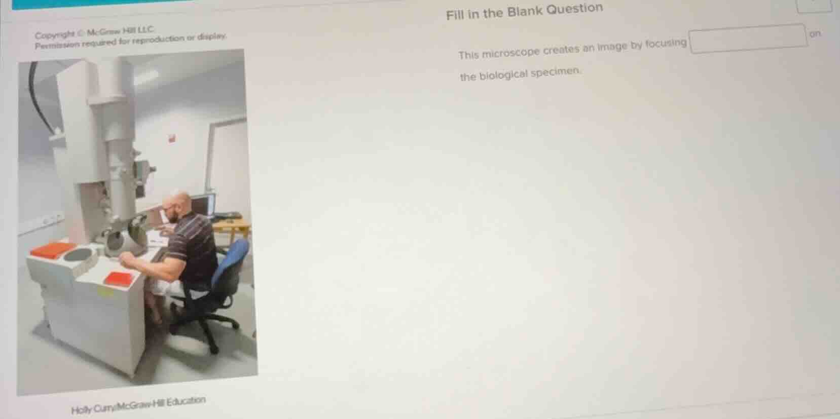 fill in the blank question this microscope creates an image by focusing…