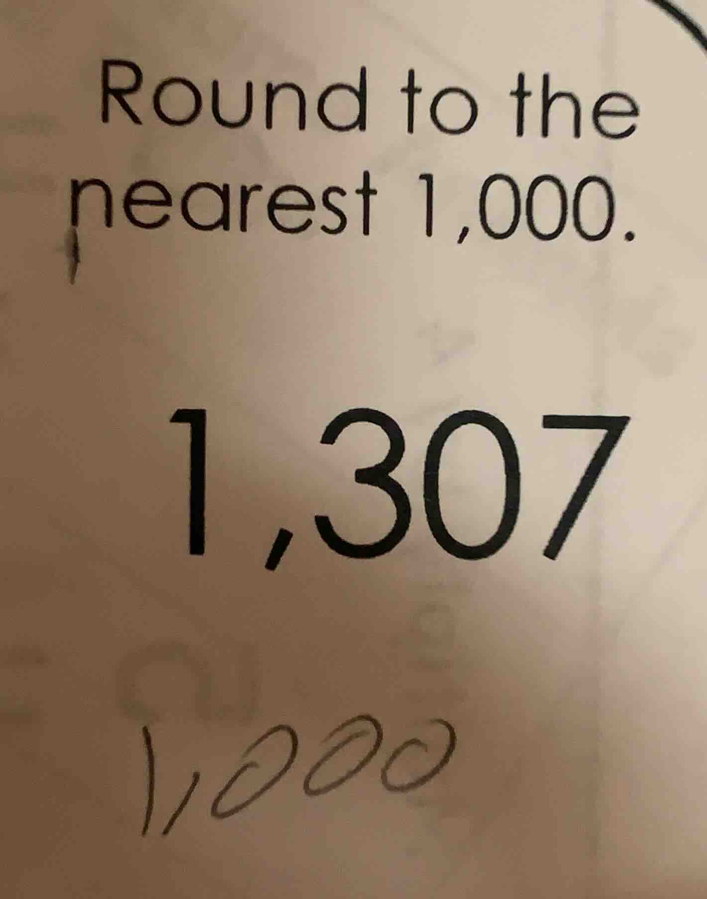 round to the nearest 1,000. 1,307