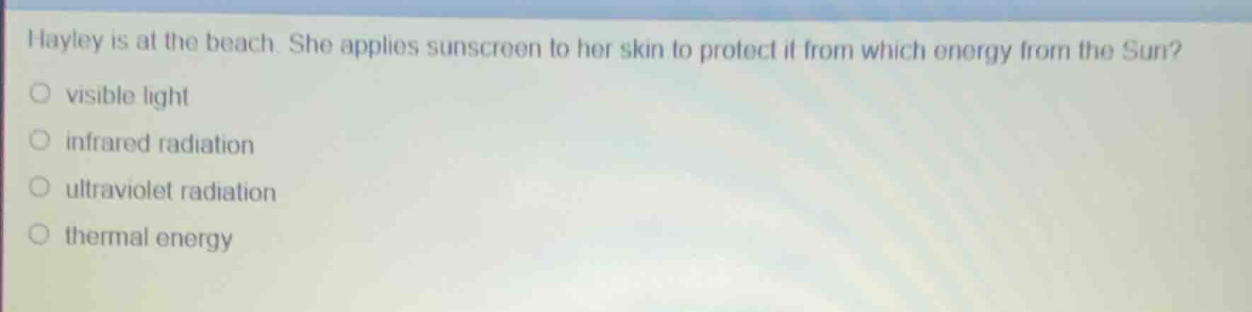 hayley is at the beach. she applies sunscreen to her skin to protect it…