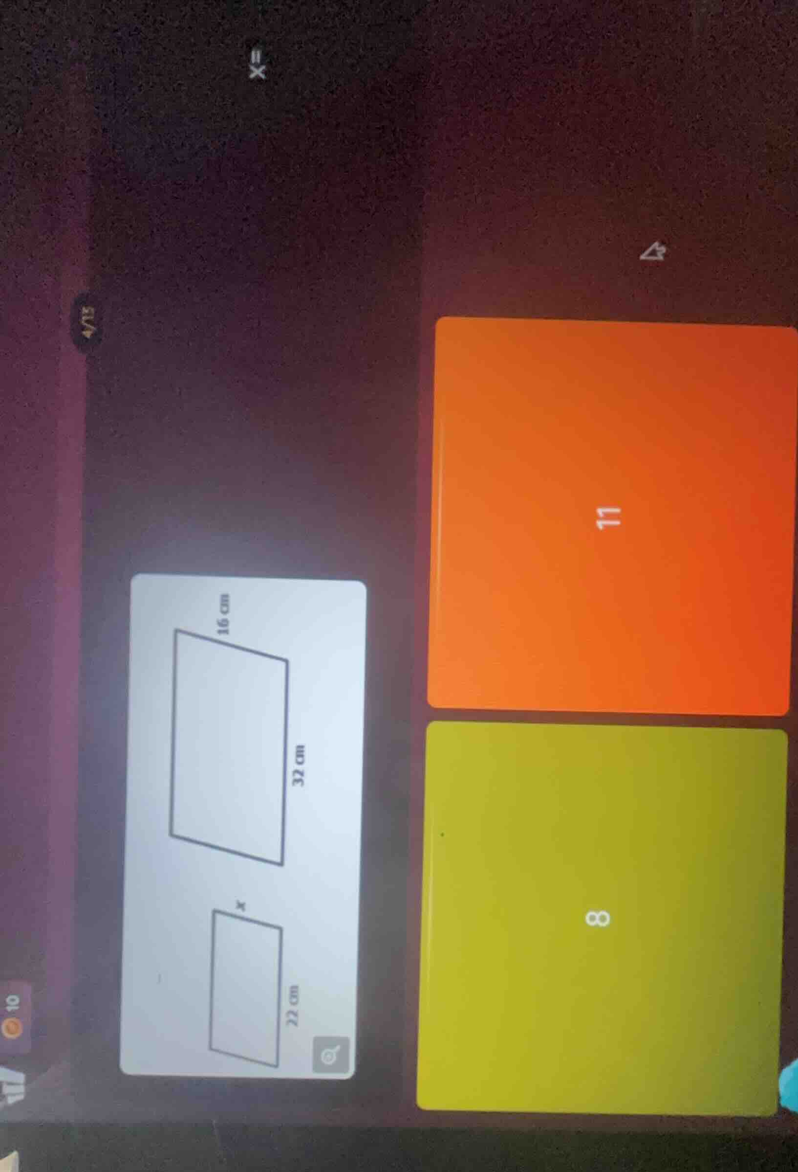 there are two rectangles. the larger rectangle has a length of 32 cm an…