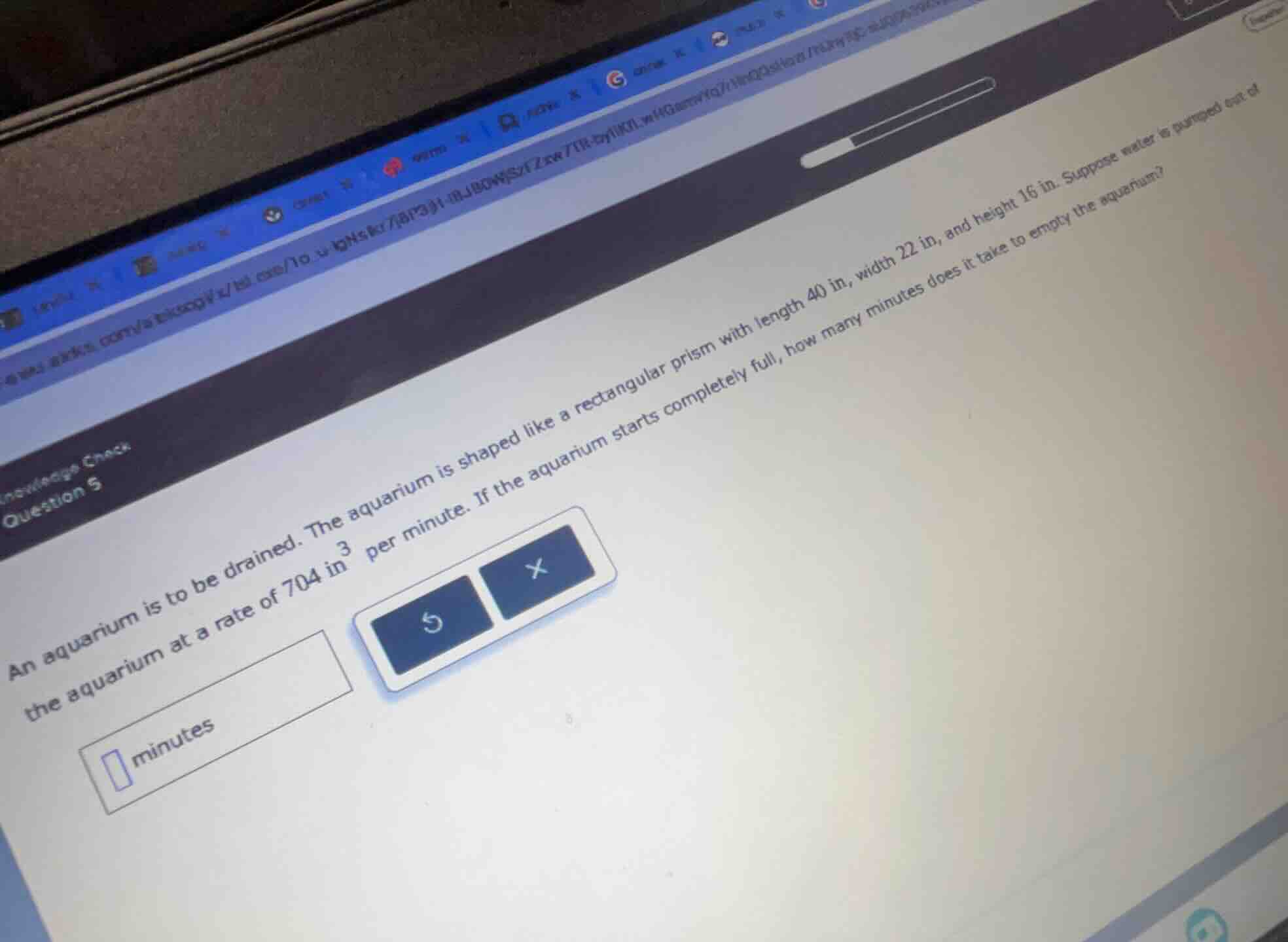 an aquarium is to be drained. the aquarium is shaped like a rectangular…