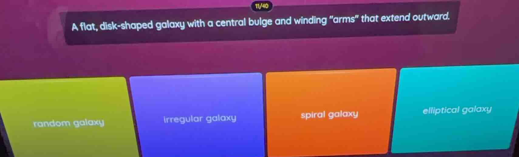 a flat, disk - shaped galaxy with a central bulge and winding \arms\ th…