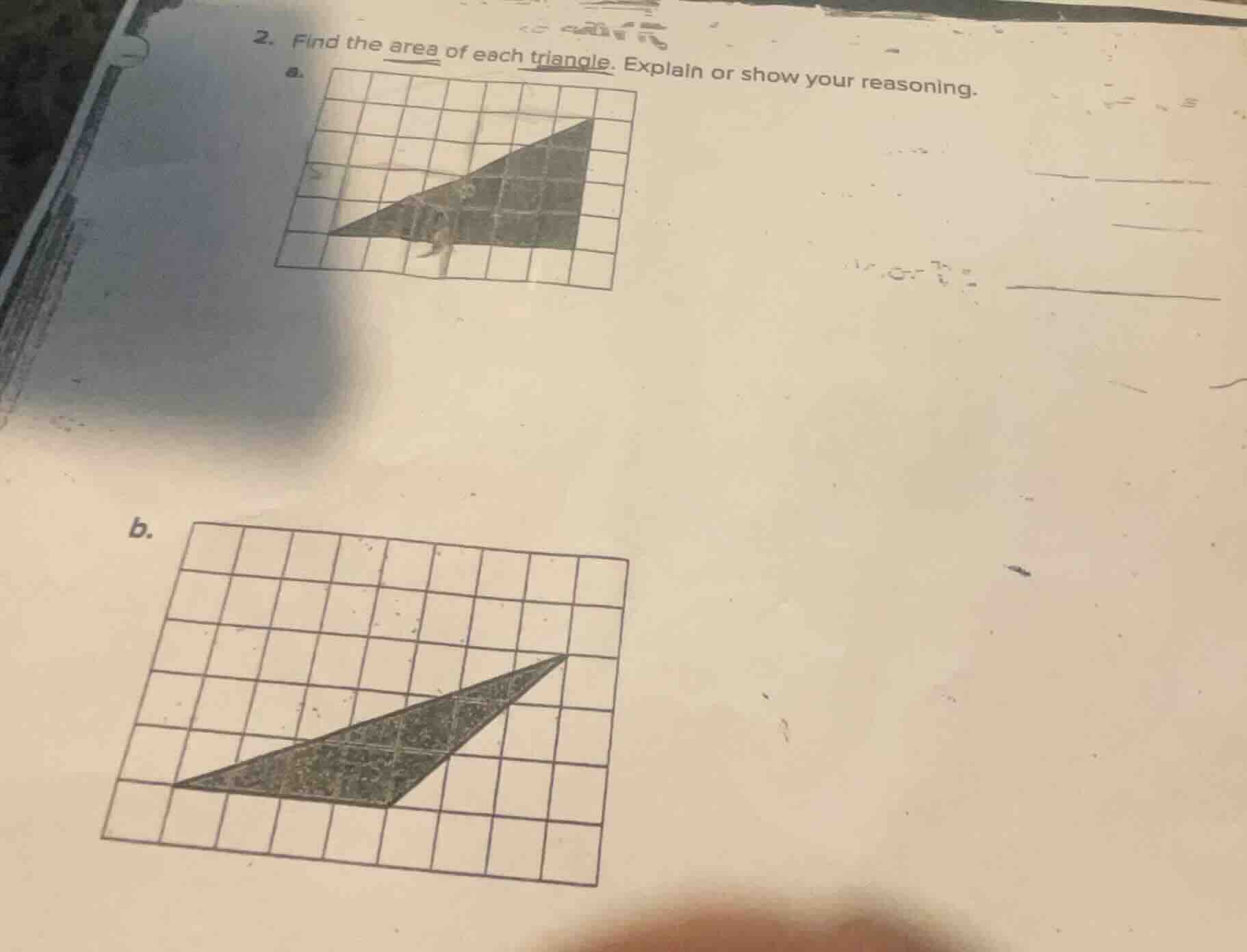 2. find the area of each triangle. explain or show your reasoning. a. b.