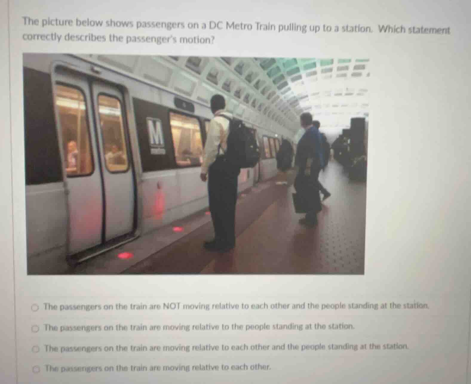 the picture below shows passengers on a dc metro train pulling up to a …