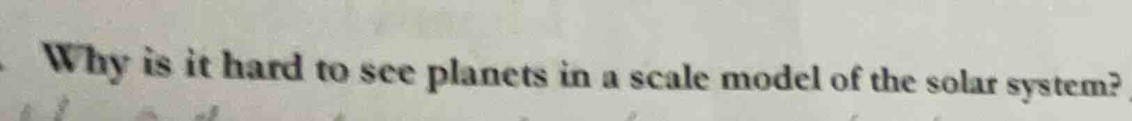why is it hard to see planets in a scale model of the solar system?