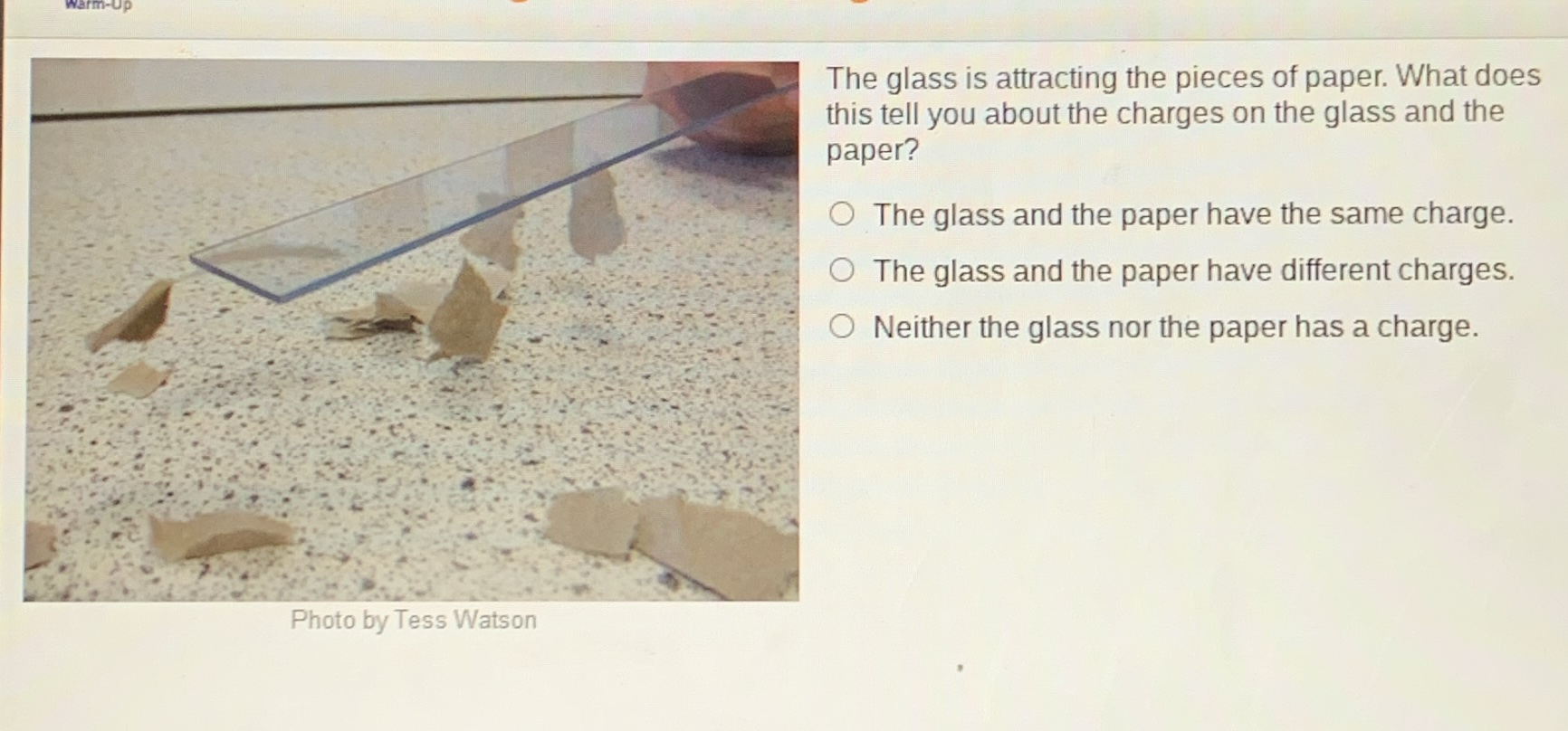 warm-up the glass is attracting the pieces of paper. what does this tel…
