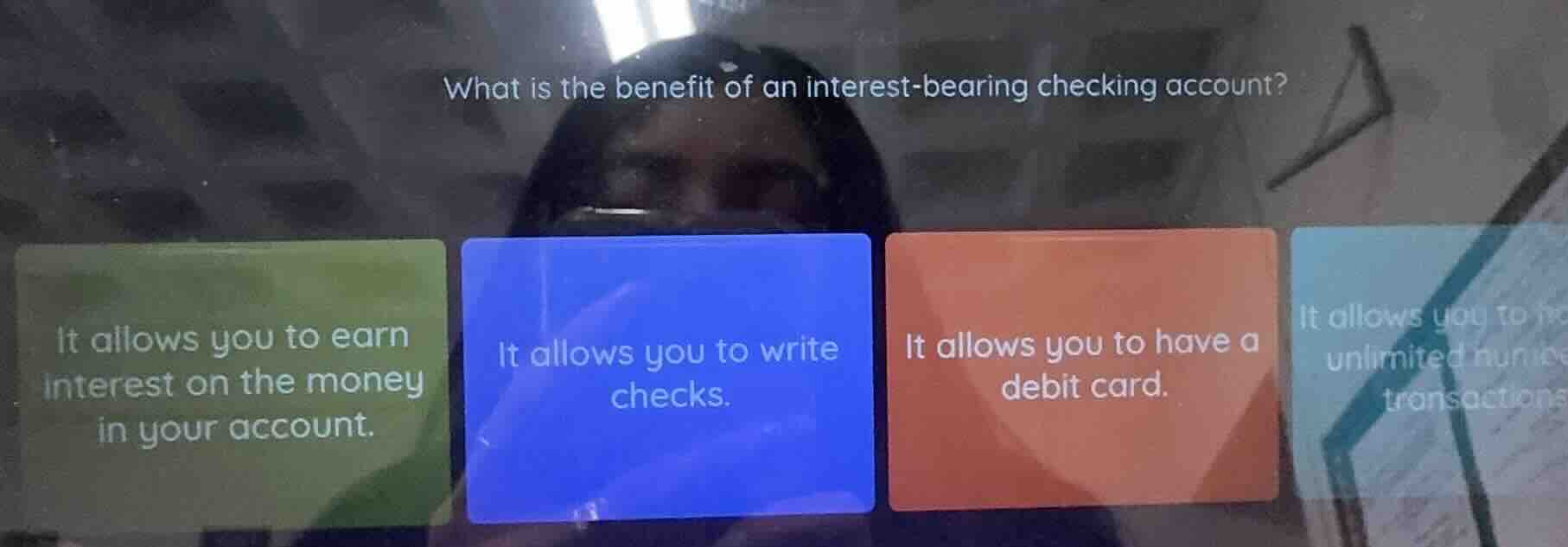 what is the benefit of an interest-bearing checking account? it allows …