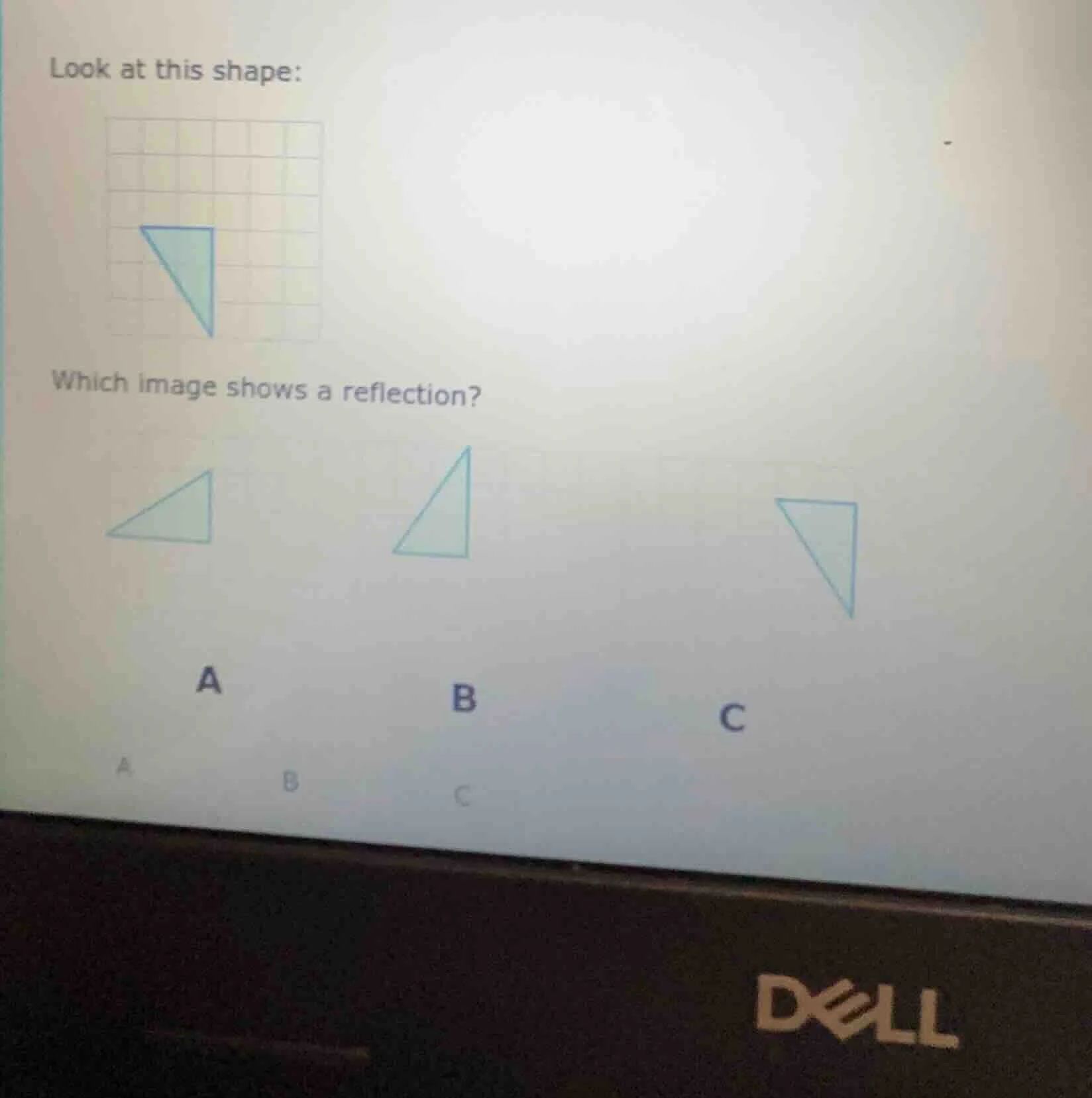 look at this shape: which image shows a reflection? a b c